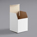 a white box with a brown lid