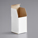 A white Lavex reverse tuck carton with an open lid.