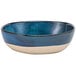 A blue bowl with a white rim.