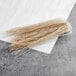 Sweet potato noodles piled on a white surface.