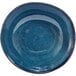 A Front of the House indigo porcelain bowl with a speckled design on the inside.