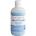 A bottle of Roxy & Rich Rainbow Moonstone cocoa butter with blue liquid.