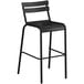 A black Lancaster Table & Seating outdoor barstool with a metal frame and backrest.