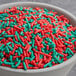 A bowl of red and green Holiday Sprinkle Mix.