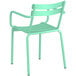 A Lancaster Table & Seating sea foam powder coated aluminum outdoor arm chair with metal legs.