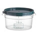 A clear plastic Vigor food storage container with a green lid.