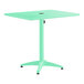A rectangular seafoam powder-coated aluminum outdoor dining table with an umbrella hole in the center.