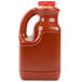 A jug of Louisiana Wildly Wicked Original Buffalo Wing Sauce with a handle.