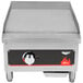 A Vollrath Cayenne flat top gas griddle with a red flame.