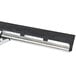 An Unger ErgoTec window squeegee with a black and silver metal handle.