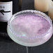 A glass with a Spirdust violet pearl cocktail.