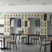 A room with tables and chairs and Regency beige lockers.