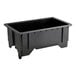 A black rectangular Vollrath ServeWell well with legs on a table.