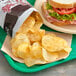 A tray with a sandwich and a bag of Goods BBQ Homestyle Potato Chips.