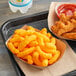 A bowl of Good's Cheese Curls on a table.