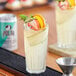 A Polar Diet Ginger Ale can on a tray with a glass of fruity drink and a straw.
