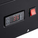 A black rectangular Avantco refrigerator with a digital display showing red numbers.