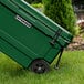 A CaterGator hunter green outdoor cooler on a lawn.