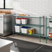 Regency green epoxy shelving in a kitchen with food containers on the shelves.