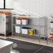Regency chrome metal shelves with plastic shelf liners holding food items.