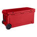 A red CaterGator outdoor cooler with wheels.