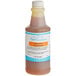 A bottle of LorAnn Hawaiian Pineapple flavor fountain syrup with a label.