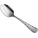 a silver spoon on a white background