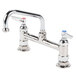 A chrome T&S deck-mounted faucet with two lever handles.
