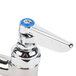 A chrome T&S deck-mounted faucet with lever handles.