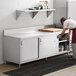 a white counter with a cutting board