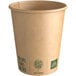 a brown paper cup with green text