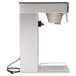 A silver Bunn 3 gallon iced tea brewer with a black and white stand.