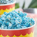 Blue and white popcorn in a bowl with blue raspberry glaze.