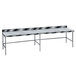 An Advance Tabco poly top work table with a long metal top.