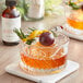 A glass of Woodford Reserve Old Fashioned with fruit on it.