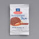 A small white package of Daelmans mini chocolate waffles with a picture of a waffle on it.