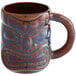 A brown Libbey Tiki mug with a face on it.