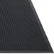 A black rubber Guardian Clean Step entrance mat with dots on it.