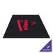 A black Guardian Media rubber mat with red text that says "pizza" on it.