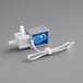 A close-up of a blue and white VacPak-It solenoid valve.