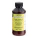 A bottle of LorAnn Oils Pineapple Bakery Emulsion on a counter.
