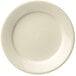 A close up of a Libbey Porcelana white porcelain plate with a plain edge.