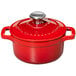 A Chasseur ruby red enameled cast iron pot with a lid.