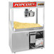 A Cretors floor model popcorn machine with a large bowl of popcorn inside.
