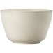 A Libbey Porcelana cream white porcelain bouillon bowl with a rolled edge and handle.