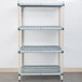 A white MetroMax Q rectangular shelf with square holes.