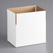 A white corrugated shipping box with a brown lid.