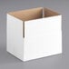 A white cardboard box with a white surface.