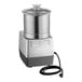 A silver and black Robot Coupe commercial food processor with a cord attached.