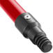 A close up of a red and black Lavex metal broom handle.